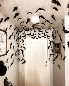 a hallway decorated for halloween with bats on the ceiling