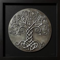 a metal plaque with an intricate design on it