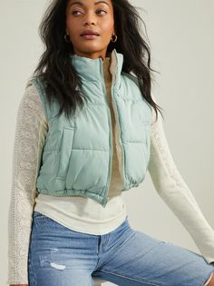 Warm up this season by adding a cozy staple to your closet with this cropped sherpa vest. The soft and fluffy fabric will keep you warm on chilly days, while the cropped length is a flattering fit. Trendy Cropped Sweater Vest For Fall, Casual Cropped Sweater Vest For Winter, Cropped Fitted Winter Vest, Cropped Outerwear For Layering, Cozy Cropped Outerwear For Spring, Fluffy Fabric, White Dress Top, Sherpa Vest, Wedding Branding