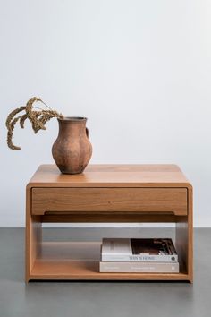 a wooden table with a vase on it