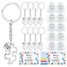 a key chain with several pieces of puzzle on it and two tags attached to them