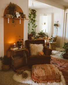 a living room filled with furniture and plants