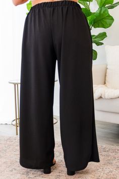 Effortlessly elevate your wardrobe with our Never Be Outdone Pants in sleek black! The high waist and elastic waistband ensure a comfortable and flattering fit, while the gold button detail adds a touch of sophistication! With a wide-leg design, these pants are perfect for both the office and a night out. Take your style to new heights! 100% Polyester Evening Wide-leg Pants With Elastic Waistband, Rayon Wide-leg Pants With Elastic Waistband, Black Non-stretch Pants With Elastic Waistband, Black Full-length Pants With Elastic Waistband, Black Wide-leg Rayon Pants, Girls Heels, Leg Design, Gold Buttons, Pants Black