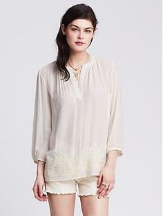 Embroidered Popover Blouse | Banana Republic Summer Embroidered Long Sleeve Top With Lace Trim, Summer Long Sleeve Embroidered Top With Lace Trim, Elegant Spring Blouse With Embroidered Hem, Chic Spring Top With Embroidered Neckline, Chic Top With Embroidered Neckline For Spring, Chic Embroidered Top For Daywear, Elegant Summer Tops With Embroidered Hem, Spring Half Sleeve Tops With Lace Trim, Feminine Embroidered Tops For Workwear