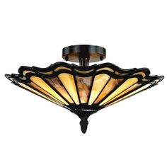 a semi flush light fixture with an intricate design on the top and bottom, hanging from a