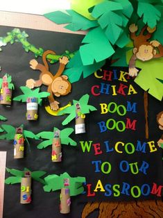 a bulletin board with monkeys, palm trees and the words chika chika boom welcome to our classroom