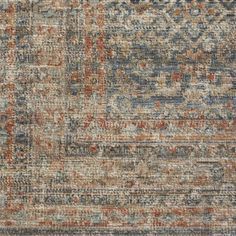 an old, faded rug with various colors and patterns on the carpet is seen in this image