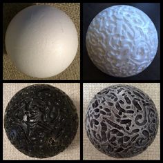 four different types of decorative balls on a tablecloth with black and white designs in the middle