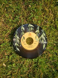 a black and yellow frisbee laying in the grass