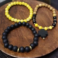 Black And Yellow Beaded Bracelet Set Adjustable Yellow Bracelet With Wooden Beads, Yellow Beaded Spiritual Bracelets, Yellow Bracelet With Round Wooden Beads, Yellow Casual Jewelry With 8mm Beads, Casual Yellow Beaded Bracelets With 8mm Beads, Casual Yellow Beaded Bracelet With 8mm Beads, Casual Yellow Jewelry With 8mm Beads, Adjustable Yellow Wooden Beaded Bracelets, Yellow Wooden Bead Bracelets