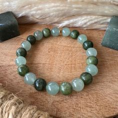 This natural stone bracelet is composed of an 8 mm bead of green aventurine and jade ✨🍀 Virtues and benefits of green aventurine On a mental/spiritual level - Brings luck and good fortune. - Calms the mind. - Calms nervousness, stress and fears. - Aids in mental calm and inner peace. - Promotes decision making. - Helps to be yourself. - Help for the creation and brings determination in the projects. - Restores humor and cheerfulness. - Brings patience, tolerance On a physical level - Acts on st Green 8mm Beads Stretch Bracelet For Meditation, Green Aventurine Stretch Bracelet With Natural Stones, Green Aventurine Crystal Bracelet With Natural Stones, Green Aventurine Stretch Bracelet Gift, Green Jade Crystal Bracelet Spiritual Style, Green Jade Crystal Bracelet For Spiritual Healing, Spiritual Green Jade Crystal Bracelet, Green Jade Crystal Bracelet For Meditation, Green Jade Stretch Bracelet For Meditation