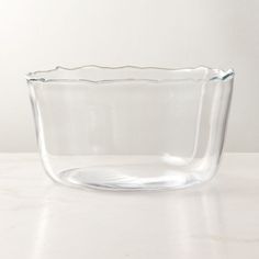 a glass bowl sitting on top of a table