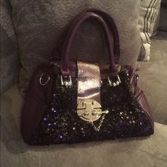 Beautiful Purple Purse With Lots Of Storage . Comes With A Adjustable Strap 10" Deep By 12" Wide . 2 Side Pockets , Back Zipper Pockets & 2 Zipper Pockets On The Inside With Lots Of Storage Silver Embellished Bag For Everyday Use, Party Bag With Detachable Strap In Metallic, Glamorous Metallic Bag For Night Out, Chic Party Satchel With Silver-tone Hardware, Silver Glitter Bag For Night Out, Glamorous Shoulder Bag For Everyday Use With Silver-tone Hardware, Silver Bag With Detachable Strap For Night Out, Party Silver Satchel With Detachable Strap, Silver Embellished Bags For Night Out