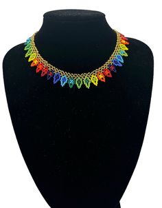 Add a touch of African ethnicity to your style with this authentic multicoloured beaded choker necklace. Handcrafted with utmost precision, this necklace perfectly blends traditional and modern design. Made with high-quality beads, it features a vibrant mix of colours that will add life to your outfit. The necklace has a variety of lengths and is suitable for all occasions. This necklace is perfect for those who love to add a touch of ethnicity to their style. The vibrant mix of colours and intricate design make it stand out from other necklaces. It is perfect for any occasion, whether a casual day out or a formal event.  Colour - Multicolour  Height - 1.6cm Neck Length: Various Lengths:  17inch(43cm) 16inch(40cm) 14inch(36cm) Material :Beads Festive Multicolor Beaded Chain Necklace, Adjustable Multicolor Beaded Necklaces For Festive Occasions, Adjustable Multicolor Beaded Necklace For Festive Occasions, Adjustable Multicolor Beaded Necklace For Festivities, Multicolor Beaded Bracelets With Dangling Beads For Festivals, Festive Multicolor Beaded Necklaces With Tiny Beads, Festive Multicolor Tiny Beaded Necklaces, Traditional Multicolor Beaded Choker Necklace, Traditional Multicolor Beaded Choker