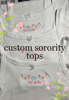 four white aprons with pink flowers on them and the words custom, sorority tops