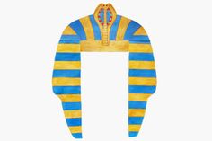 an egyptian hat with blue and yellow stripes on the front, sitting against a white background