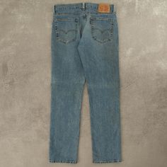 Women's Vintage Levi's 514 Midwash Jeans  + Damage: Marks, Rip To Leg  + Closure: Zip  + Colour: Blue  + Size Label States: W32 X L32  + Actual measurements (inches): W33 X L32  + Measurements (Inches): Hem = 7.5, Rise = 10  Please note that all vintage items have been previously worn, and may show some signs of previous wear. However, any significant damage will be photographed and/or stated in the items listing. Please note that damage to the inside may not always be photographed or listed. Casual Washed Blue Straight Bottoms, Casual Straight Washed Blue Bottoms, Light Wash Straight Fit Bottoms With Pockets, Medium Wash Straight Fit Pants With Pockets, Straight Fit Medium Wash Pants With Pockets, Blue Straight Pants With Relaxed Fit, Classic Straight Washed Blue Bottoms, Classic Washed Blue Straight Bottoms, Medium Wash Pants With Pockets And Straight Hem