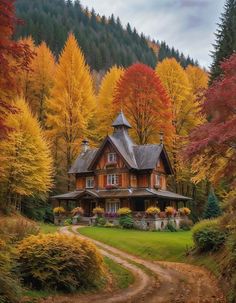 a house in the middle of a forest surrounded by trees with yellow and red leaves