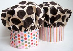 two cupcakes with polka dots on them sitting side by side in paper cups