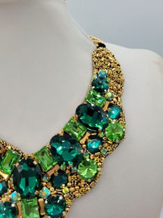 Party Crystal Emerald Necklace, Party Emerald Crystal Necklace, Green Crystal Necklace With Jewels, Luxury Necklace With Stones For Celebration, Luxury Green Stone Necklaces, Green Costume Jewelry Necklace, Luxury Handmade Beaded Necklaces For Party, Handmade Luxury Beaded Necklace For Parties, Unique Rhinestone Necklaces For Gifts