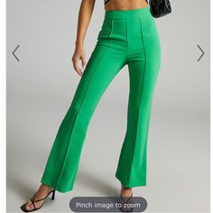 Bright Green High Waisted Pants With Flared Bottom Made Of 100% Polyester. Great For Office Or Normal Wear Chic Green Full Length Bottoms, Chic Full Length Green Bottoms, Fitted Flare Bottoms In Green, Green Fitted Flare Bottoms, Fitted Flare Green Bottoms, Green Elastane Trousers, Green High Waist Stretch Dress Pants, Green High-waist Stretch Dress Pants, Green Stretch High Waist Dress Pants