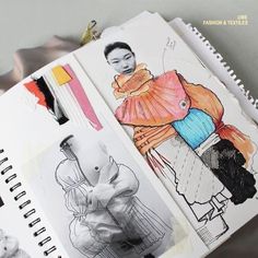 an open book with drawings and pencils on it