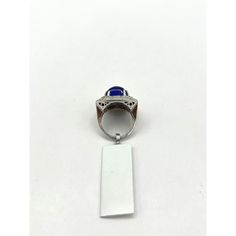 This is part of Chairish’s Fine Jewelry assortment.  Gorgeous big size tanzanite rectangular cabochon with good quality white diamond rounds.  Handmade in 18k white gold.  This ring was bought in a large lot so accurate weights are unknown but close approximation can be given in message.  Ring size 7.25. Formal Hallmarked Diamond Cabochons, Elegant White Gold Cabochons For Formal Occasions, Elegant Formal Cabochon Ring, Formal Cabochon Sapphire Ring, Elegant Sapphire Signet Ring, Classic White Gold Sapphire Cabochon Ring, Elegant Cabochon Sapphire Ring For Formal Occasions, Elegant Formal Cabochon Sapphire Ring, Formal Sapphire Cabochon Rings