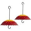 two red and yellow umbrellas hanging from hooks