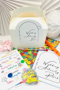 WEDDING ACTIVITY BOX Full of activities to keep little guests entertained during the day and evening for inclusion in your special day. Make them feel extra special by giving them their own activities to complete. Each Box Contains:- 1. Pack with 20 sheets of activities (puzzles, dot to dot, mazes & colouring) and swop point crayon  2. I Spy Card 3. Snakes & Ladders Game 4. Sheet of Smiley Faced Stickers 5. Pinball Game 6. A surprise Lucky Dip Toy 7. Bag of Marshmallows Boxes will be supplied fl Kids Wedding Favours, 3 Snakes, Childrens Wedding Favours, Snakes Ladders, Kids Wedding Favors, Simple Wedding Reception, Arch Balloon, Ladders Game, Wedding Activity