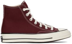 High-top canvas sneakers in burgundy. Round rubber cap toe in off-white. Lace-up closure in white. Eyelet vents and leather logo patch at inner side. Tonal webbing trim at heel. Rubber midsole in off-white featuring black stripes and logo patch at heel. Rubber outsole in brown. Silver-tone hardware. Supplier color: Deep bordeaux/Egret | Converse Burgundy Chuck 70 High Sneakers Casual Burgundy Sneakers With Contrast Sole, Burgundy High-top Sneakers For Streetwear, Casual Burgundy High-top Sneakers, Red Shoes Sneakers, Burgundy Converse, Converse Chuck Taylor 70, Chuck Taylor 70, Converse Chuck 70, High Sneakers