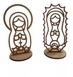 two metal sculptures depicting the virgin mary and baby jesus, each with an oval frame