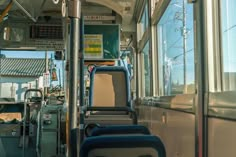 the inside of a bus with empty seats