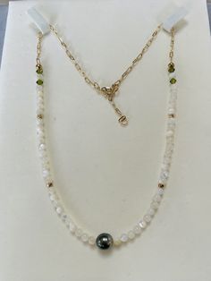 Welcome to Mandyhboutique! Genuine high luster near round Tahitian pearl in the middle size about 7.5-8mm. The necklace consists of mother of pearl beads, swarovski crystal and 14k gold plated extended chain.  *tahitian pearls are unique and rarely perfect. Sometimes they will have slight imperfections, small blemishes or irregular shapes.* **handmade jewelry** **Warranty** We do understand that handmade jewelry can be delicate, that's why we are offering a 30-day warranty for your purchase. If your item has a manufacturing defect or broken during this time frame, please contact us and we will offer free repair for you. Please note we are not responsible for normal wear and tear or failure to adhere to the care instruction on the jewelry. Some of the items can be customized if you have a d Elegant Pearl White Necklace With Faceted Beads, Elegant Rondelle Pearl Necklace With Faceted Beads, Pearl White Necklaces With Faceted Beads, Elegant Faceted Rondelle Pearl Necklace, Elegant Pearl Necklace With Faceted Rondelle Beads, Pearl White Necklace With Faceted Beads, Tahitian Pearl Drop Necklace With Round Beads, Tahitian Pearl Chain Necklace With Round Beads, Tahitian Pearl Chain Necklace