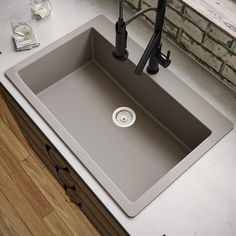 a kitchen sink sitting on top of a counter