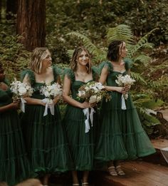 the bridesmaids are all dressed in green dresses