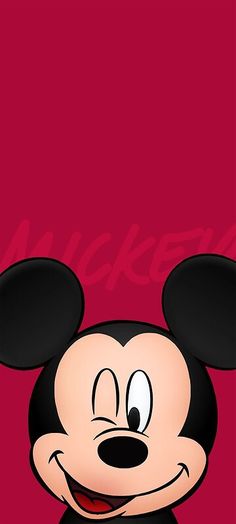 a cartoon mickey mouse is smiling and looking at the camera with a red background behind him