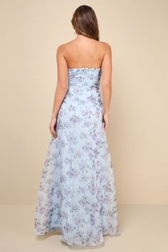 a woman in a strapless dress with floral print on the skirt and back view