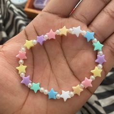 Stretchy pastel stars and pearls beaded bracelet.  One size fits most, made from stretchy bead jewelry string. Handle with care, keep away from children under 9 years old.  Keep away from toddlers, babies and infants. Avoid pulling, stretching and expanding bracelet too far out or it'll break of course Pastel Beaded Bracelets Gift, Adjustable Pastel Beaded Bracelets, Adjustable Pastel Beaded Jewelry, Adjustable Pastel Beaded Bracelet, White Star-shaped Bracelet With Colorful Beads, Pastel Stars, Pearl Beaded Bracelet, Pearl Jewellery, Bracelet Ideas