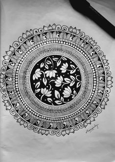 a black and white drawing of a floral design