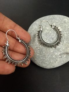 "These are purely handmade hoop earrings in oxidised silver . a high quality German silver sun hoops earrings . These are an authentic Indian traditional earrings that could be worn by both traditional and an western attire. This Unique jewellery is designed and crafted at Abi CreatioNzs Abi CreatioNzs is the place for anyone who Is in lookout for a latest trend with an ethnic touch.  We at Abi CreatioNzs offers a great range of Indian Ethnic jewellery's. We are strongly committed to  providing our customers  some uniquely handcrafted products with utmost satisfaction.  Note: The product shipped will be same as shown in the picture however, actual colours may vary slightly from those shown due to lighting in the photography Pls note The shades of gold / silver  may vary slightly. We do not Bohemian Sun Design Earrings For Festival, Bohemian Silver Hoop Earrings For Festivals, Handmade Bohemian Sterling Silver Hoop Earrings, Silver Bohemian Hoop Earrings With Oxidized Finish, Bohemian Sun Design Drop Earrings, Bohemian Oxidized Hoop Earrings For Festival, Silver Bohemian Hoop Earrings For Festivals, Bohemian Sterling Silver Hoop Earrings For Festivals, Bohemian Oxidized Hoop Jewelry