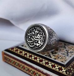 Engraved Sterling Ring | Written Ya Qamar Bani Hashim | Engraved On Sterling Silver 925 Ring | Turkish Style Ring Description: Style: Engraved Written As (YA QAMAR BANI HASHIM) Ring: Shia Ring | Muslim Ring Color: Black Metal: Sterling Silver 925 Handmade: Yes, handmade artisan ring Will be Shipped Via FedEx Intl Priority Service. No Custom duty will be charged by our customers. Customer Policy: Your satisfaction is our priority. We guarantee you our products quality exceed its real value. All y Spiritual White Gold Engraved Ring Gift, Spiritual White Gold Engraved Ring For Gift, Spiritual Silver Signet Ring For Wedding, Sterling Silver Signet Ring With Intricate Design, Traditional White Gold Sterling Silver Signet Ring, Symbolic Engraved Gemstone Ring As Gift, Traditional White Gold Signet Ring For Anniversary, Traditional Silver Signet Ring For Anniversary, Silver Engraved Wedding Ring With Gemstone