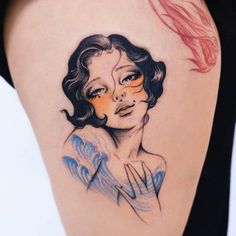 a woman's thigh with an artistic tattoo on it