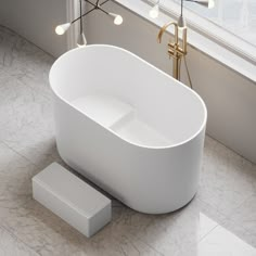 a white bathtub sitting next to a window with lights on the windowsills