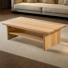 a wooden table sitting on top of a white carpeted floor next to a couch