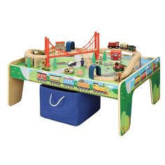 a toy train table with cars and trucks on it for children's play time