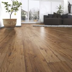 a living room with wood flooring and a price sign on the wall that says priced to clear