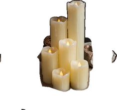 a group of white candles sitting next to each other