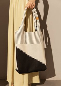 Indulge in sophistication and style with our Two Tone Canvas Colorblock Tote Bag. Made with premium canvas material, this handbag is the epitome of elegance and luxury. The two-tone design adds a touch of exclusivity, perfect for the fashionable woman on the go. Elevate your fashion game with this must-have accessory. Size info 11" (28cm) width 14 5/8"(37cm) height 4"(10cm) depth Details Open top Top carry handles Canvas Item #463001 Women's tote bag Knitted Tote Bag, Bandeau Au Crochet, Crochet Hairband, Striped Phone Case, Color Block Tote, Knitting Tote Bag, Knitting Tote, Crochet Shoulder Bag, Soft Leather Bag