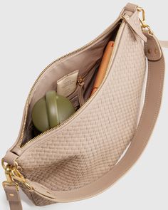 Meet our Italian Leather Handwoven Crossbody. Handwoven using 100% top-grain Italian leather, this luxe carry-all features two detachable straps so you can style it over your shoulder or as a classic crossbody.  | Quince | Women's Italian Leather Convertible Crescent Handwoven Shoulder Bag in Taupe Natural Color Versatile Shoulder Bag With Woven Leather, Elegant Woven Leather Shoulder Bag, Elegant Woven Crossbody Shoulder Bag, Elegant Woven Leather Crossbody Shoulder Bag, Luxury Woven Leather Crossbody Shoulder Bag, Libra Moon, Lifestyle Photography, Quince, Italian Leather