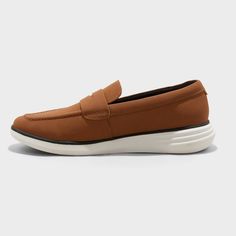 Get dressed for a day in the office and a night out with these Kobi Hybrid Loafer Sneakers from Goodfellow & Co™. These hybrid loafer sneakers showcase a cognac-color polyurethane upper and white TPR outsole. Featuring a pull-on design for easy on and off, these medium-width sneakers include a cushioned footbed and memory foam insole for extra comfortable wear. Goodfellow & Co™: Feel good in what you wear, anywhere. Casual Brown Slip-ons With Brogue Detailing, Casual Wingtip Slip-ons For Business, Brown Slip-ons With Removable Insole For Office, Brown Synthetic Loafers For Business Casual, Brown Moc Toe Synthetic Loafers, Brown Synthetic Moc Toe Loafers, Modern Brown Slip-ons For Business Casual, Brown Cushioned Loafers For Business Casual, Casual Brown Slip-on Oxfords